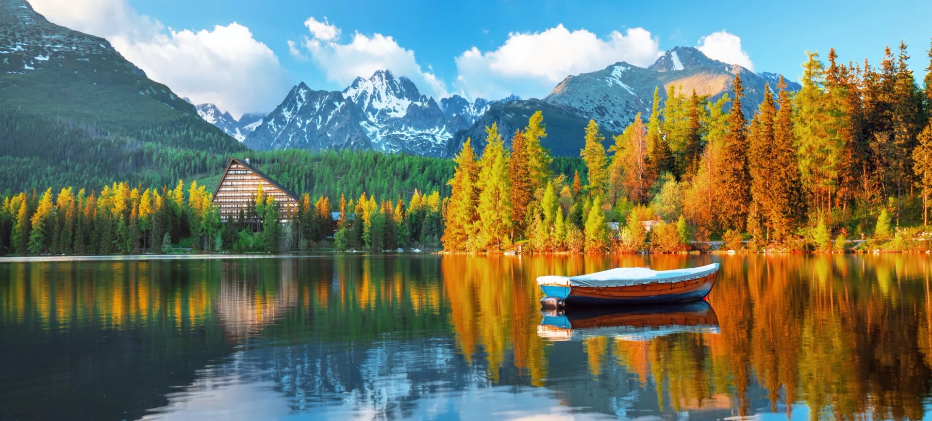 Beautiful sunrise view in High Tatras mountains national park and Strbske pleso (Strbske lake) beautiful mountain lake in Slovakia